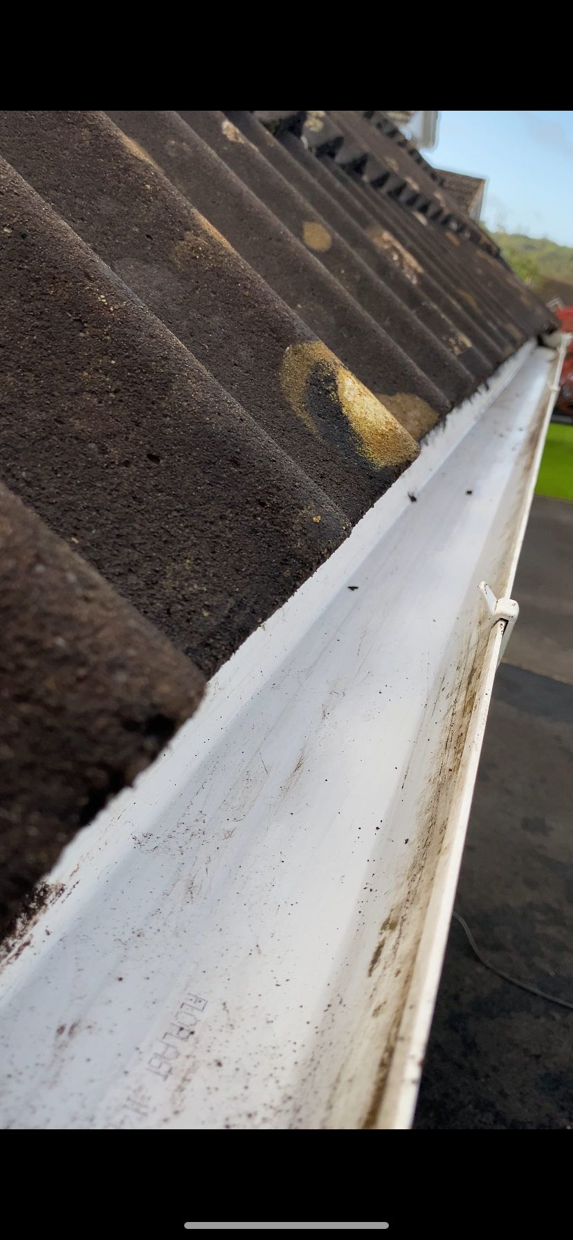 The same gutter cleared of moss and debris